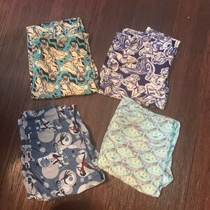 4 pairs of one size Disney Lularoe leggings
